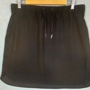 Lululemon On The Fly Skirt Women's 12 Black‎ Woven Linerless Wrinkle Free Travel